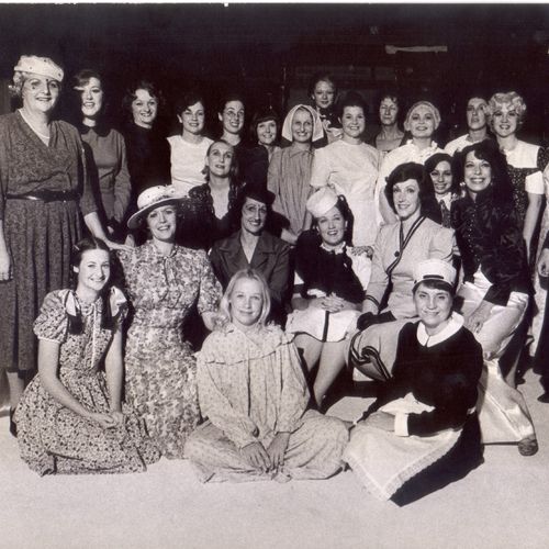 The cast of The Women, 1975. Jennifer Blocksidge is left front row, second from the end with broad-brimmed hat.